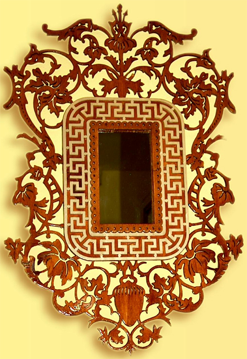 Wooden frame with floral motifs and a greek key